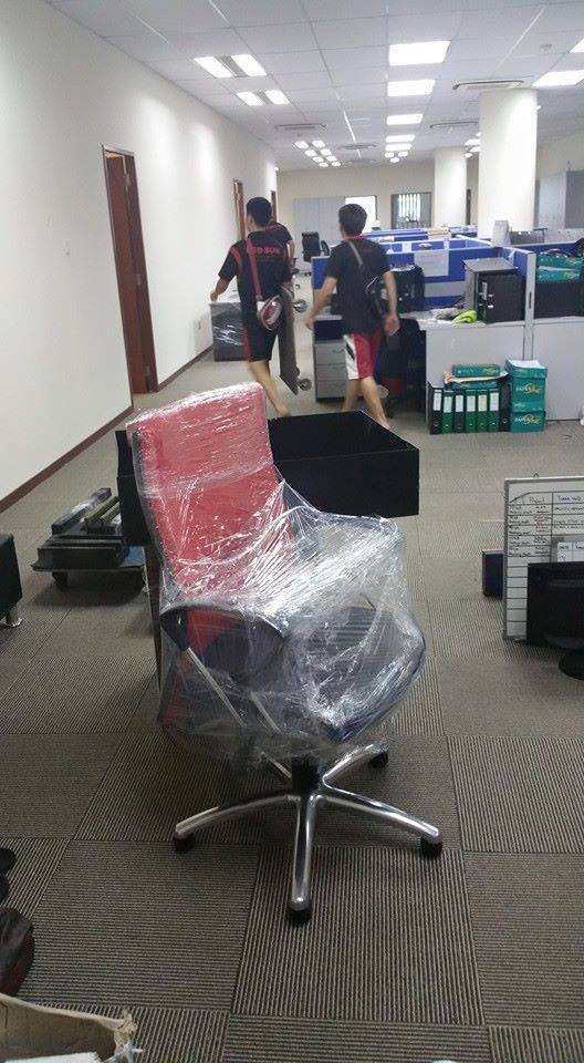Movers moving office equipment in Jurong Singapore